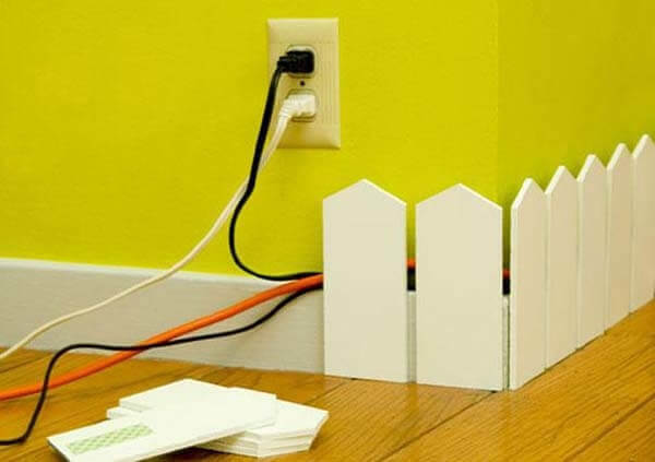 Use A Tiny Fence To Hide Your Cords